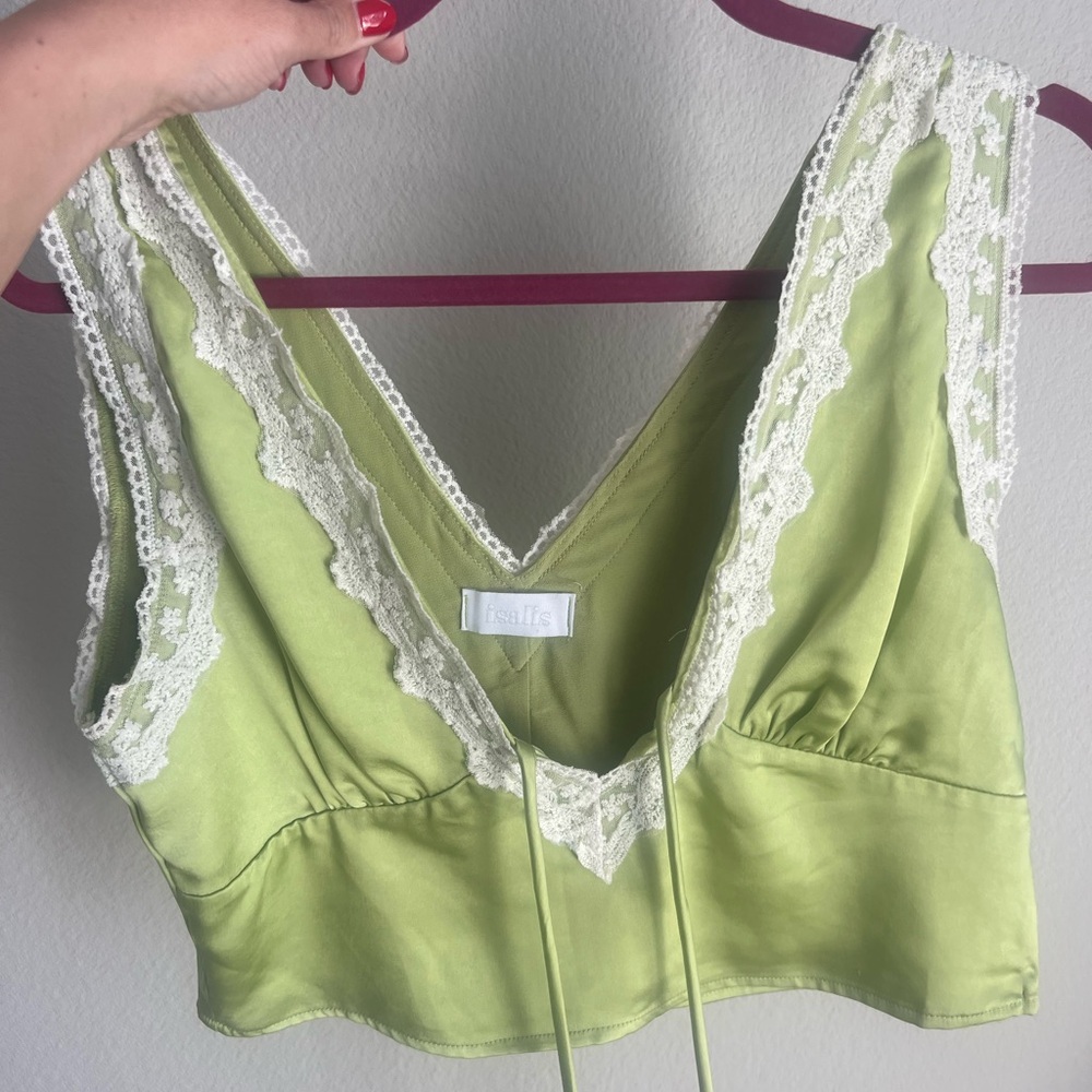 Cropped green top. It ties in the front.